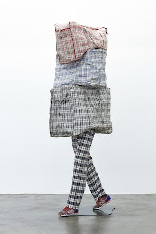Dan Halter, Patterns of Migration, 2015. Found plastic weave bags, custom-made tartan fabric, mannequin legs, and Adidas CLOT ZX Flux. Courtesy of the artist and WHATIFTHEWORLD Gallery