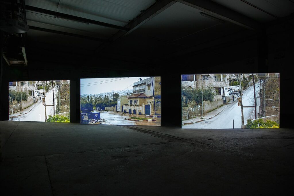 Public Studio, Road Movie (2015), 6-channel video installation, sound installation with 6 megaphones and LED lights; 3 walls, each 7 x 12 feet, 52 min (26 min each side)Photo Miriam O'Connor, Courtesy Public Studio, National Film Board of Canada and EVA International - Ireland’s Biennial, Still (the) Barbarians, Limerick City, Ireland, 16 April – 17 July 2016, www.eva.ie