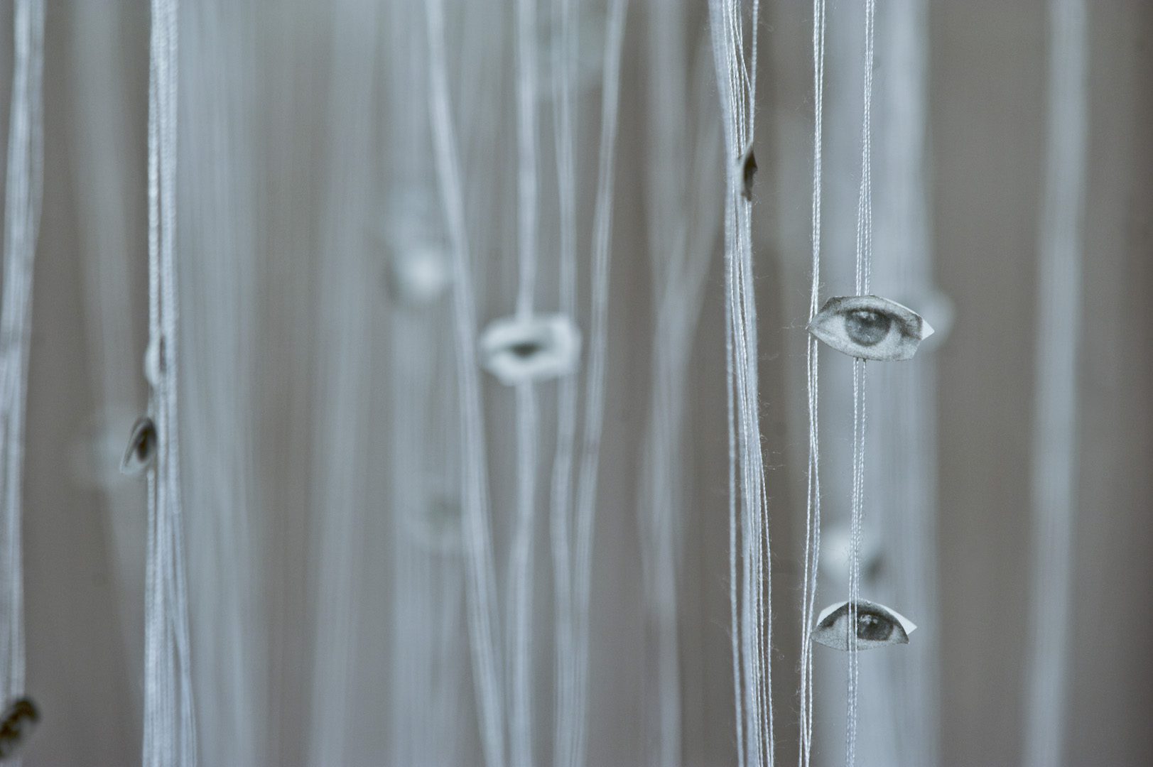 Safaa Erruas, Invisibles, 2011. Installation, cut photos and cotton threads, different sizes. Courtesy of collection CulturesInterface, Casablanca