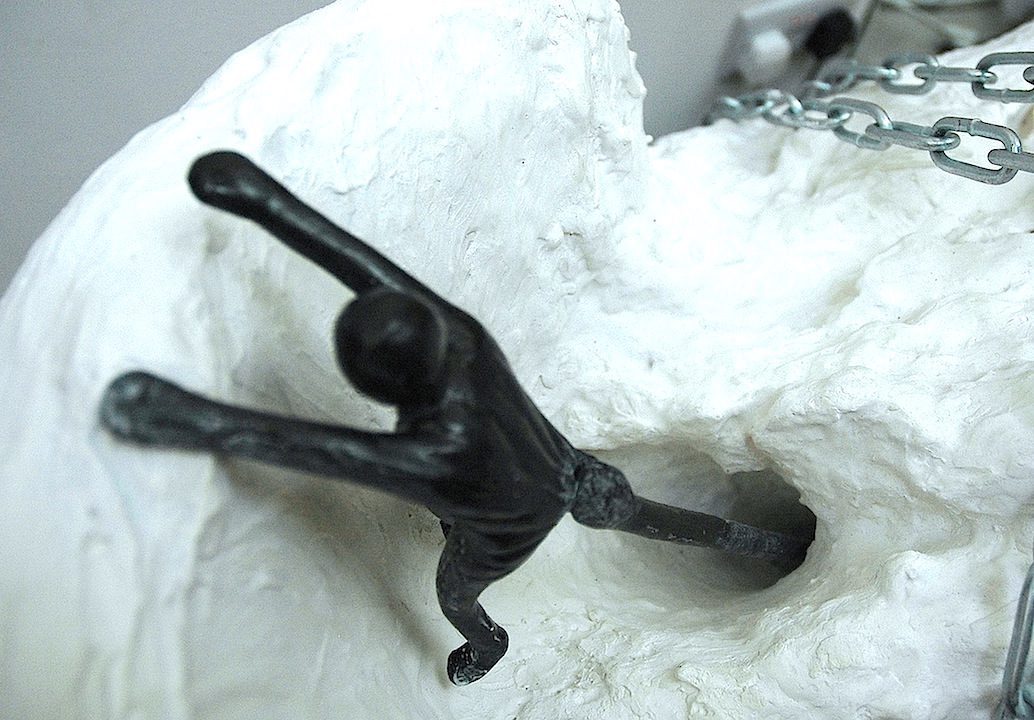 Arlene Wandera. Pulled
2013. 60 x 42 x 38cm
(Height variable). Plaster, Plastic Bucket, Chains, Ratchet Block, 2 Everymen.