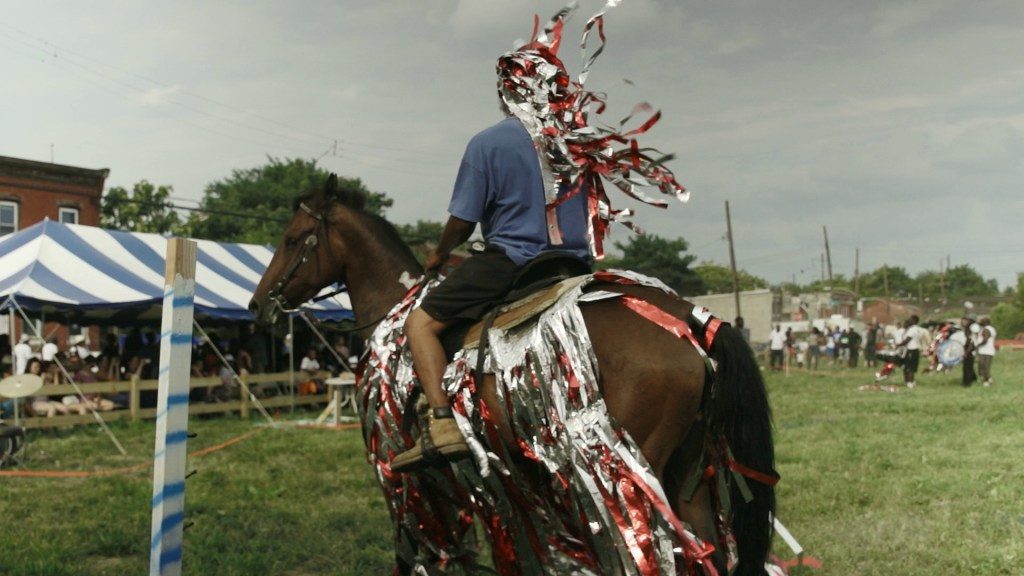 Mohamed Bourouissa. MOHAMED BOUROUISSA, “Still from Horse Day,” 2015 (video diptych, 14 mins, 7 secs.). | © ADAGP Mohamed Bourouissa. Courtesy the artist and kamel mennour, Paris/London via Barnes Foundation