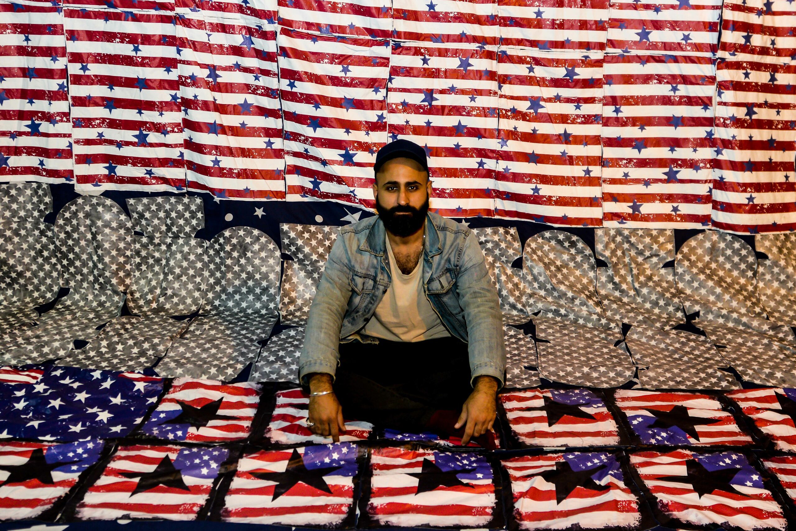 The artist Ibrahim Ahmed and his censored work, Does Anybody Leave Heaven, 2019. Image credits: Hesham Mohamed Hassan