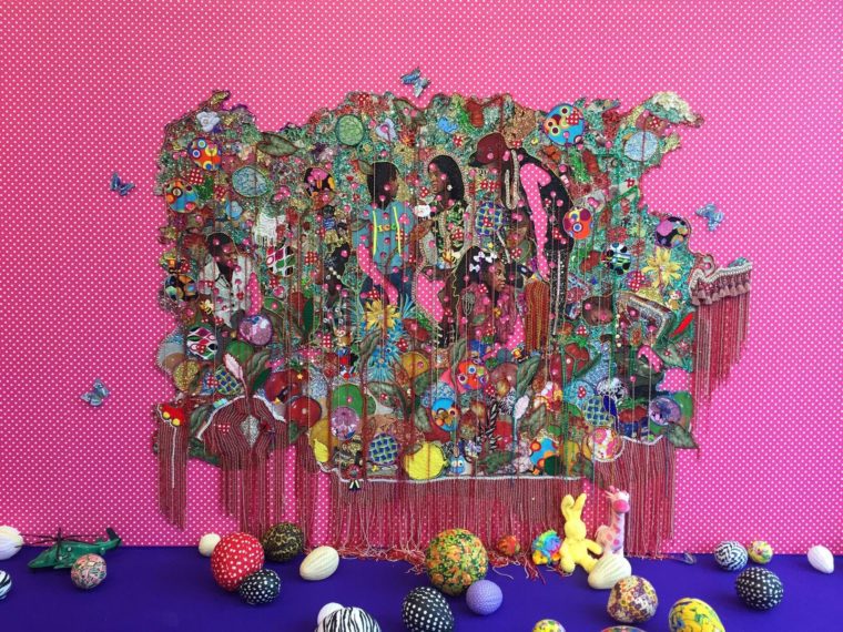 Ebony G. Patterson. ...love… (…when they grow up…). 2016. Mixed media on hand-cut jacquard woven tapestry with beads, appliqués, embellishments, brooches, plastic, glitter, fabric, stuffed toys, papier-mâché balloons, on wallpaper fabric. Collection of Dr. Anita Blanchard and Marty Nesbit, Chicago. Photo: Courtesy of the artist and Monique Meloche Gallery, Chicago.