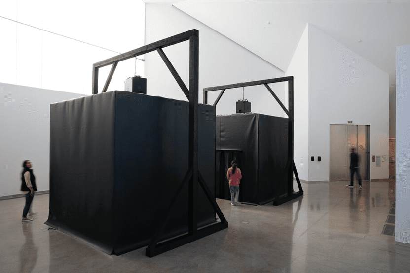 Jeremy Toussaint-Baptiste, Get Low (The Fall/The Drop), 2021. Wood, polyethylene, tinted glass, subwoofer, and water from the James River. Installation view, ICA at VCU, 2021. © Institute of Contemporary Art at Virginia Commonwealth University. Photo: David Hale.
