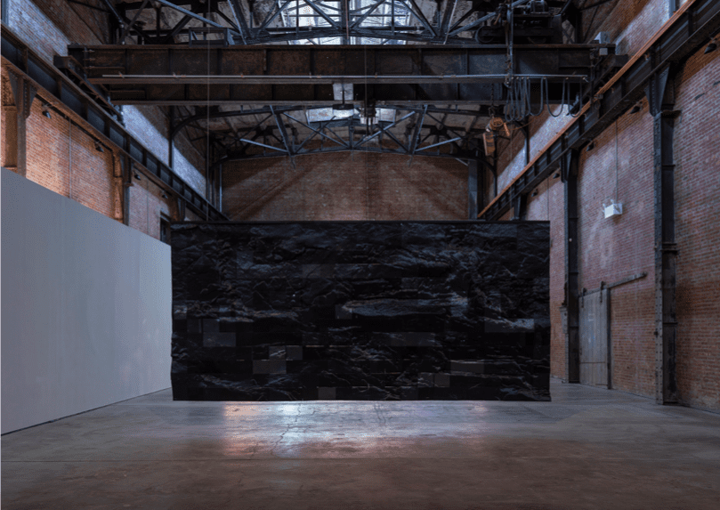 Lydia Ourahmane and Yuma Burgess, Untitled, 2022, installation view, Lydia Ourahmane: Tassili, SculptureCenter, New York, 2022. Photogrammetry, generative adversarial network, polylactide thermoplastic, anodized steel. 222 inches x 106 inches (563.9 x 269.2 cm). Courtesy the artists. Photo: Charles Benton